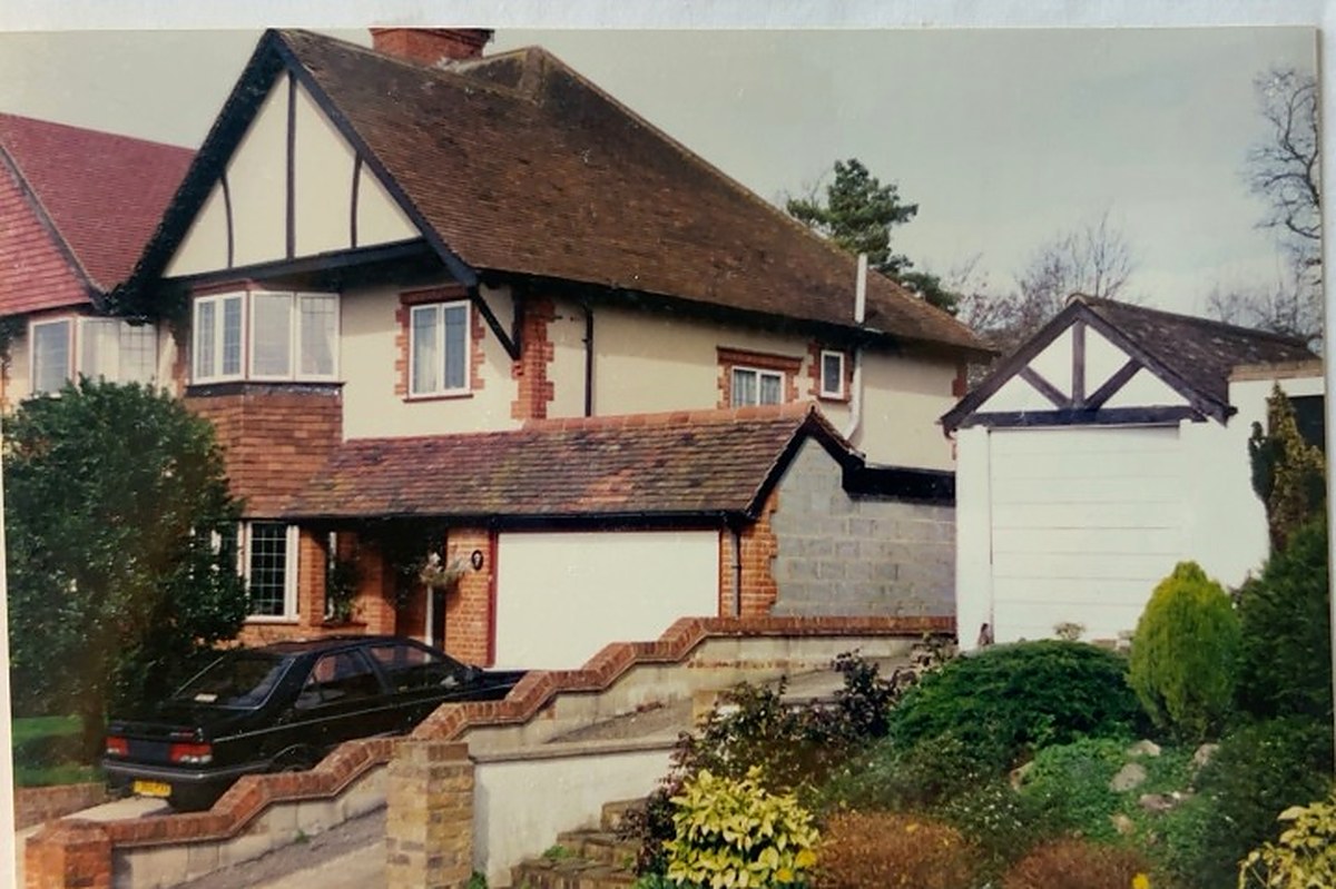 Archive photograph of a completed attached garage, porch and utility room at a red brick house in Coulsdon, its new pitched roof tiled to match the tiles on the existing house