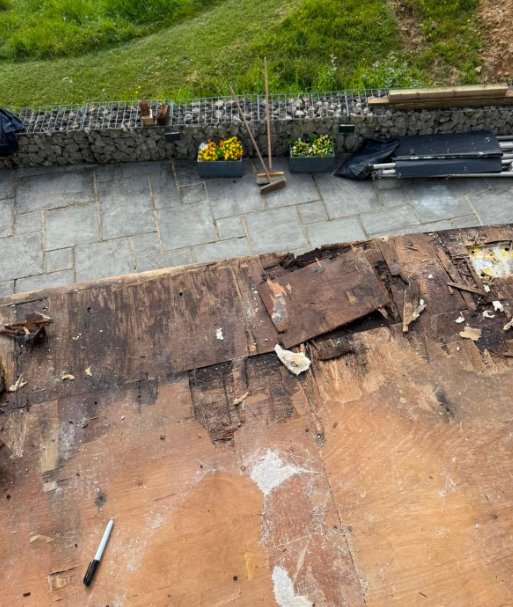Rotted balcony substrate exposed after strip-out
